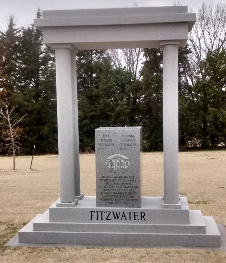 Gray stone monument with columns and the name Fitzwater at the base.