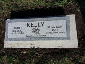 Granite cemetery headstone with floral engraving