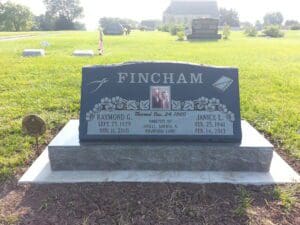 Granite double headstone with small portrait