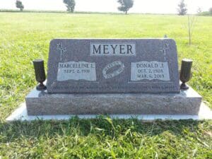 Granite gravestone engraved "Meyer" in cemetery