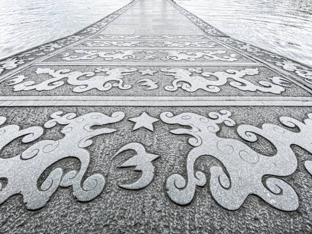Ornate patterned stone walkway over water