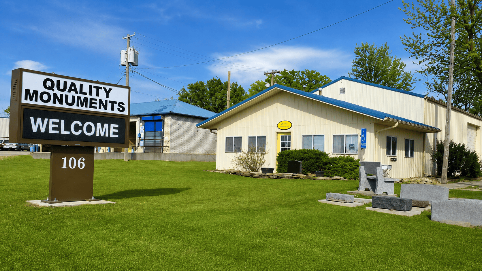 Quality Monuments storefront, sign, and stone displays