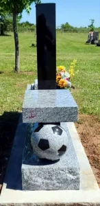Soccer-themed memorial with granite base