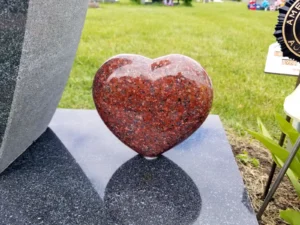 Heart-shaped red granite memorial piece