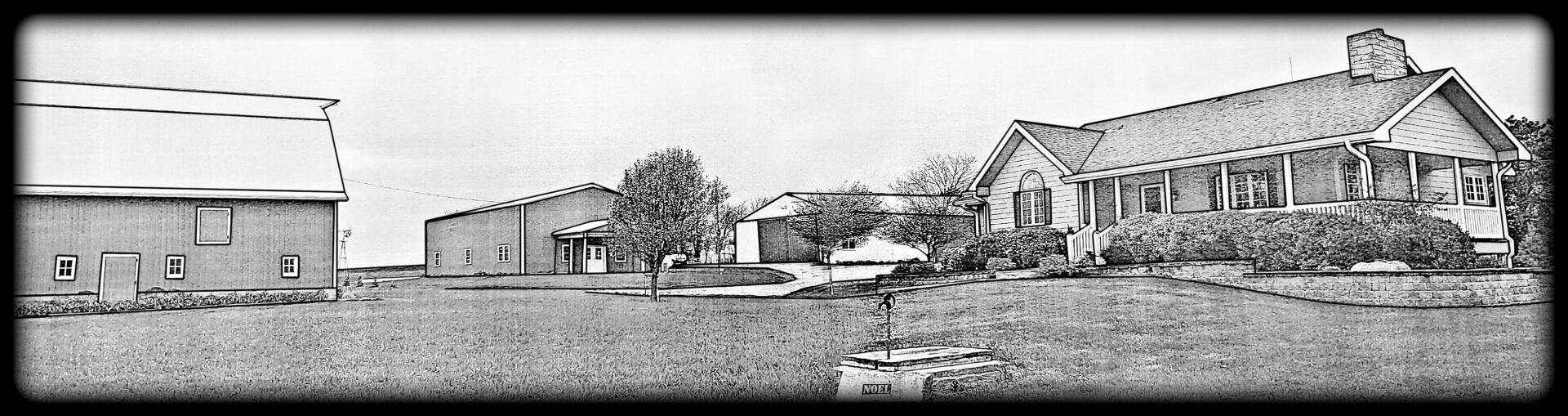 Rural landscape featuring buildings and pathways.