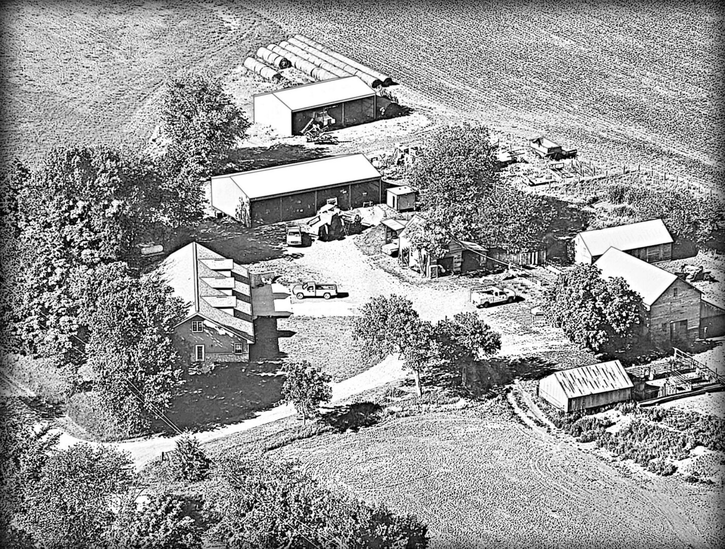 Aerial view of a rustic farmstead.
