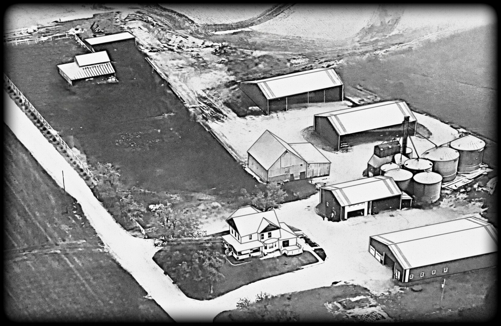 Aerial view of a rural farmstead layout.