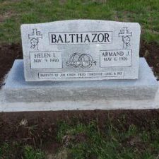 Granite gravestone with engraved family details.
